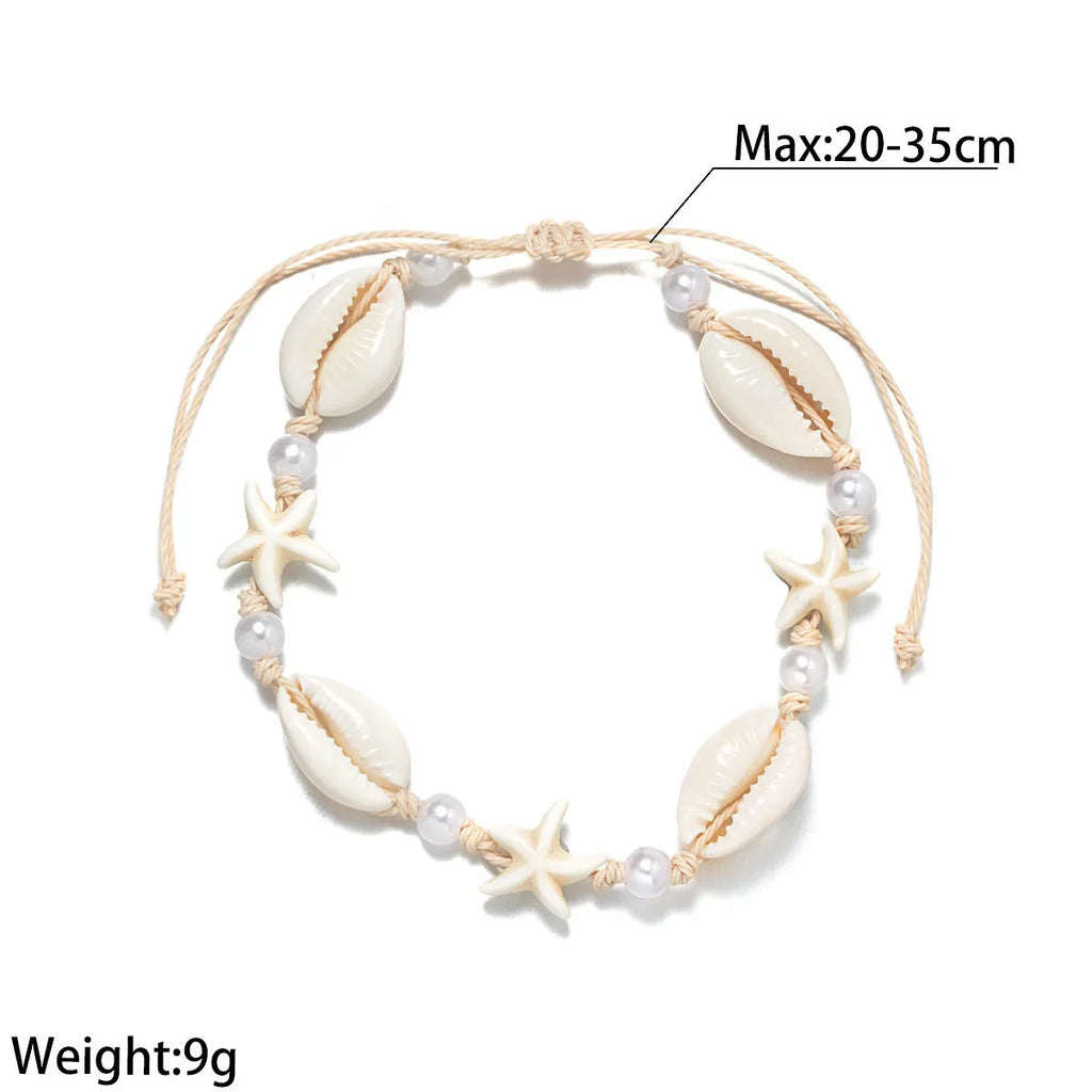 Women's white plastic resin starfish shell pearl anklet on foot with adjustable waterproof wax line