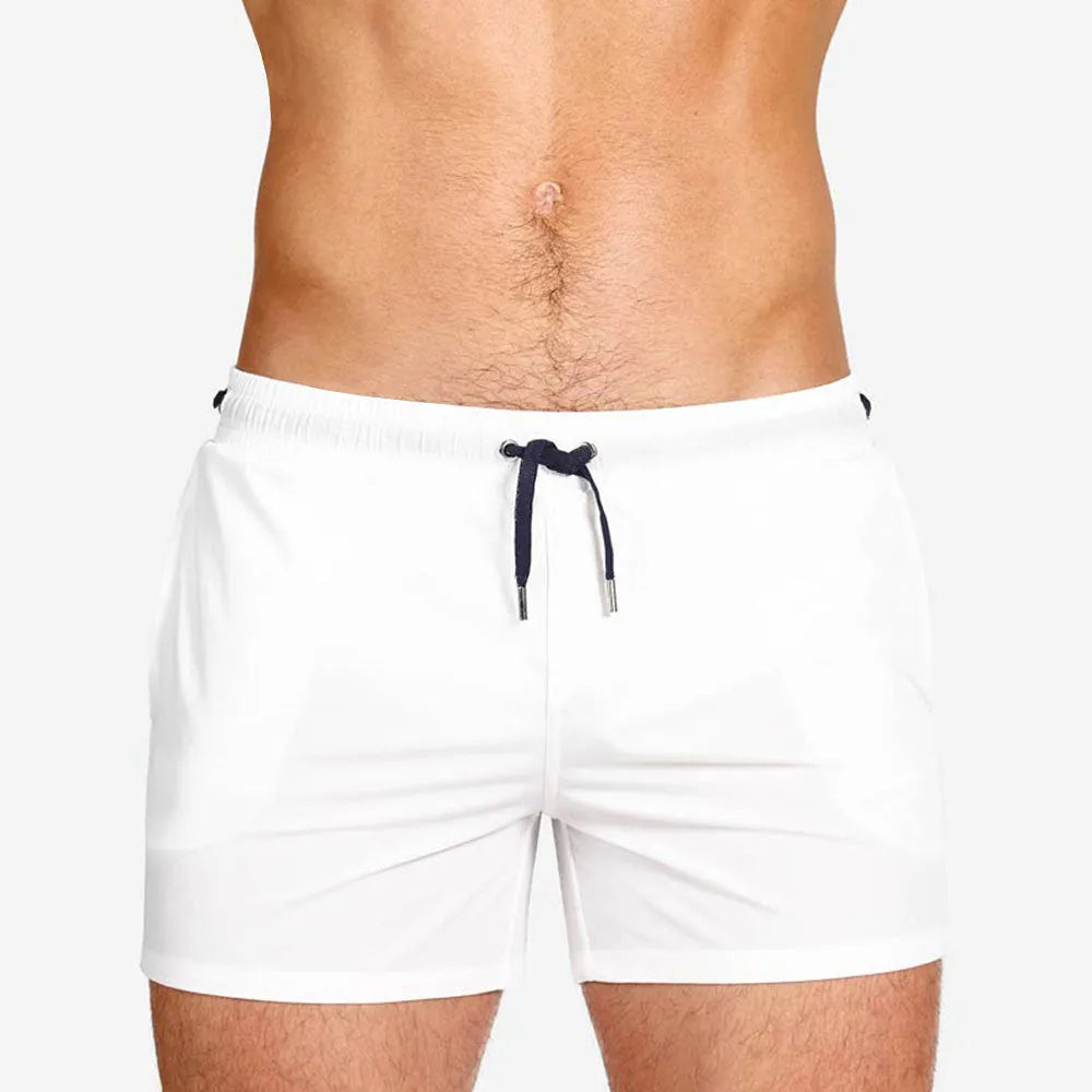 Mesh lining polyester sports shorts in solid colours for swimming and fitness.