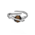 White gold colour Saturn Tigereye open adjustable ring for women on display