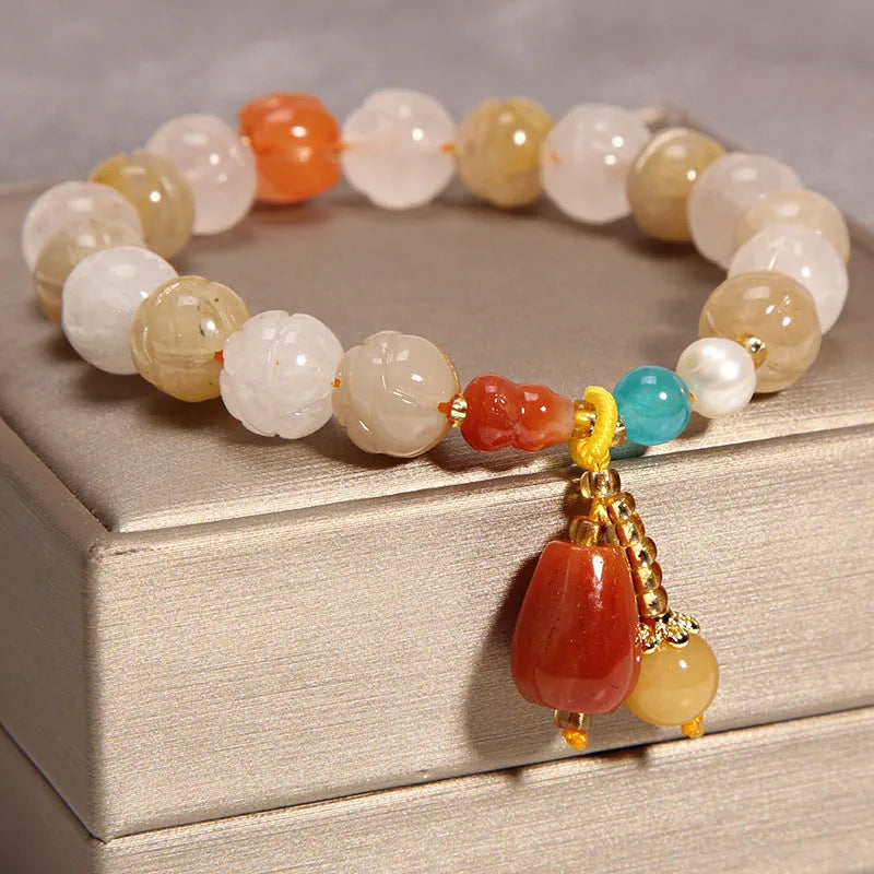 Khaki yellow agate and crystal women's bracelet on gold silk string.