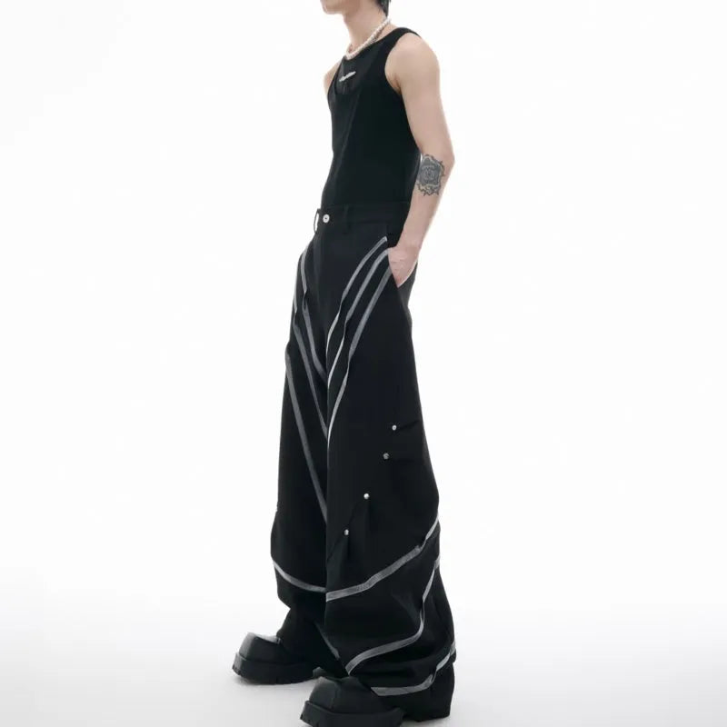 Men's polyester trousers with three-dimensional cut, metal striped rivets, and pleated front.