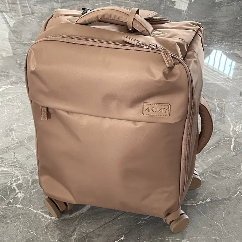 Ultra-light waterproof Oxford cloth suitcase with universal wheels in bluestone green colour.