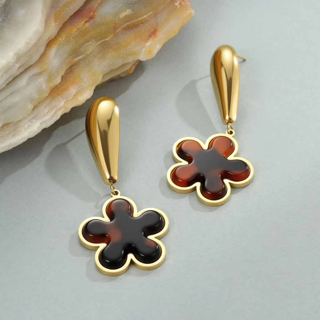 Women's tortoiseshell resin finish earrings with heart or flower designs in 18K gold electroplated stainless steel