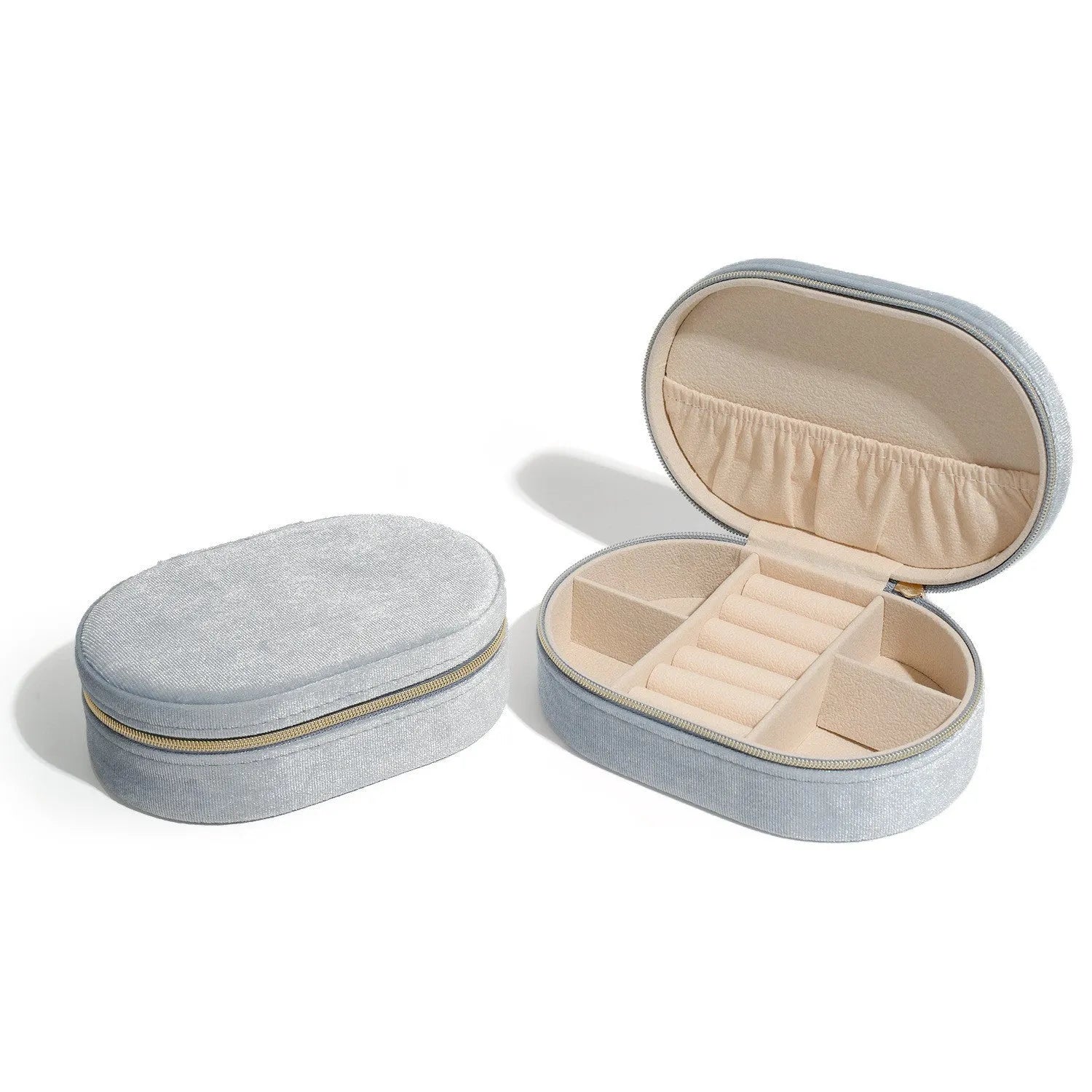 Oval velvet jewellery storage box in lake blue colour, showing flannel-lined interior and compact size.