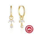 A pair of 925 sterling silver earrings with a geometric sunflower design inlaid with golden zircon stones.