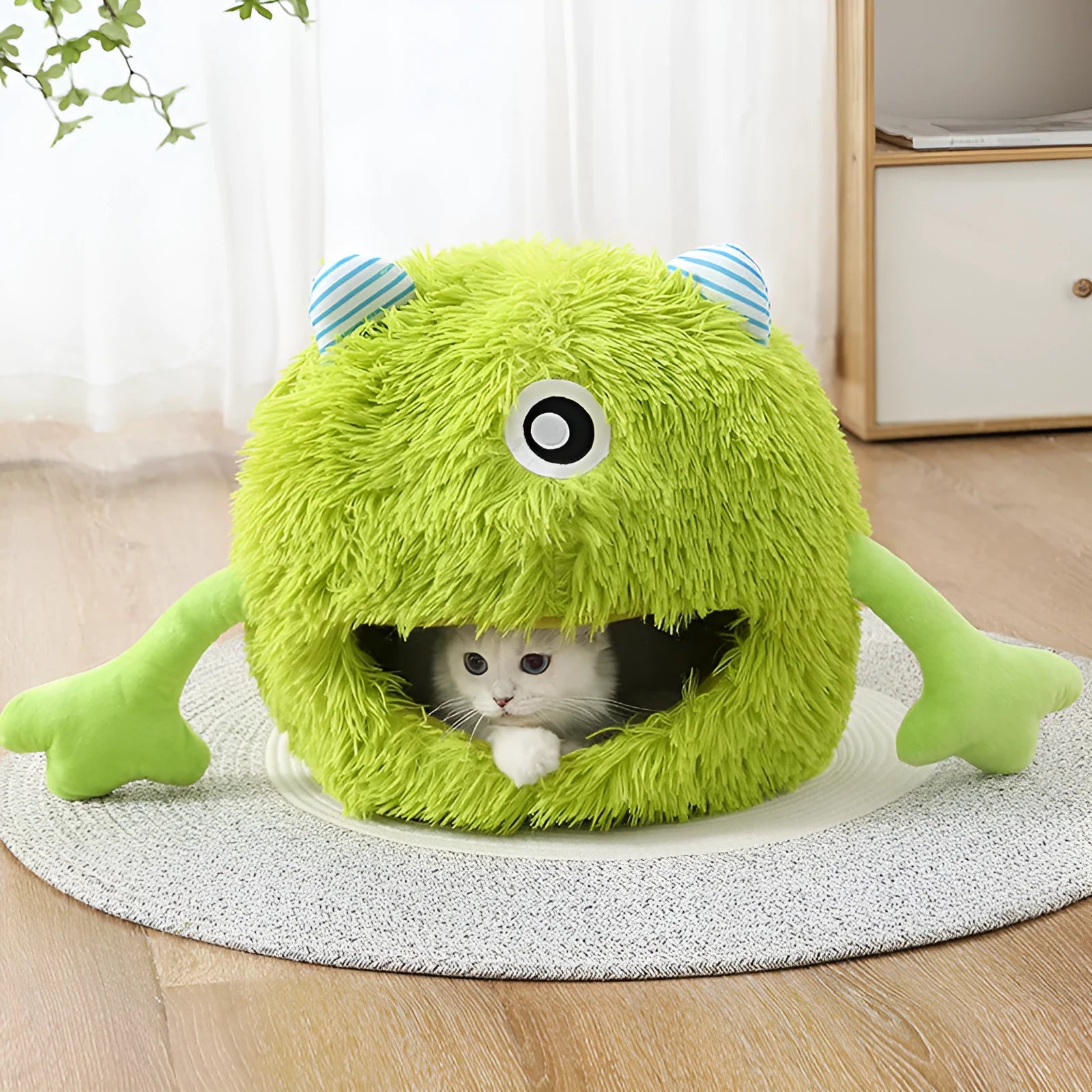 Round fluffy plush cat bed with a non-slip base, shown in three sizes.