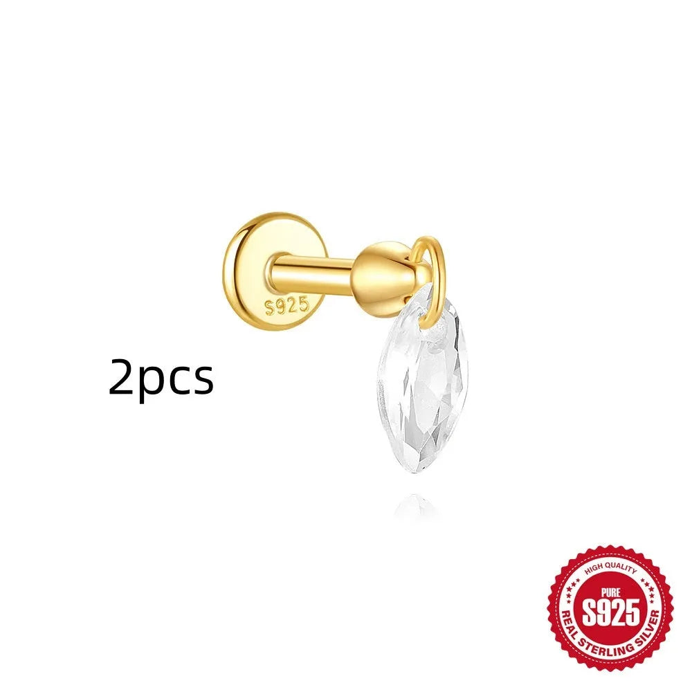 Geometric kite-shaped sterling silver earrings with a gold electroplated chain tassel featuring rhinestones.