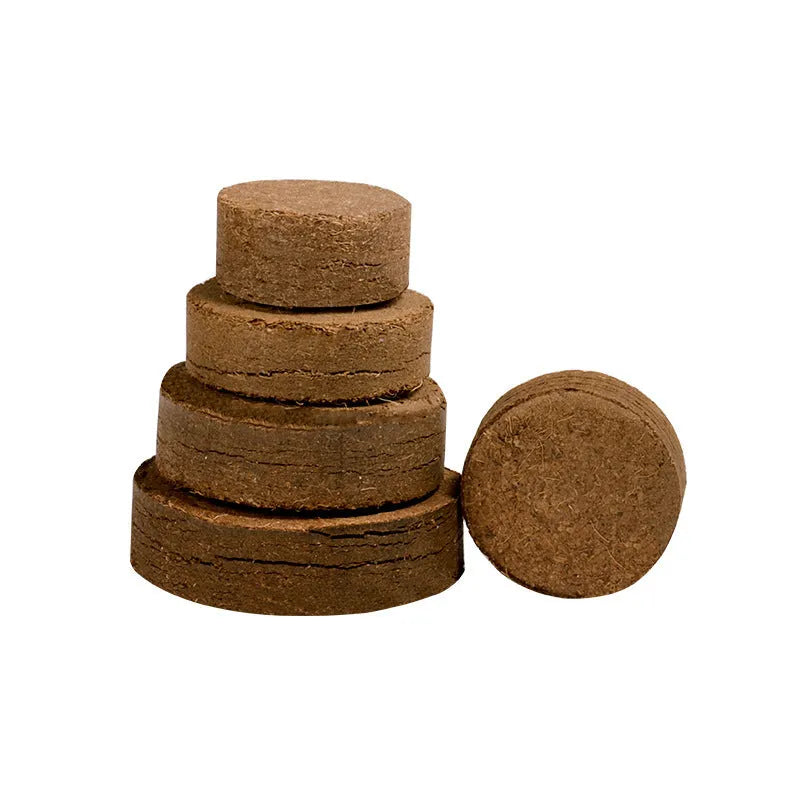 Assortment of nutrient soil planting blocks in different sizes on a garden table.