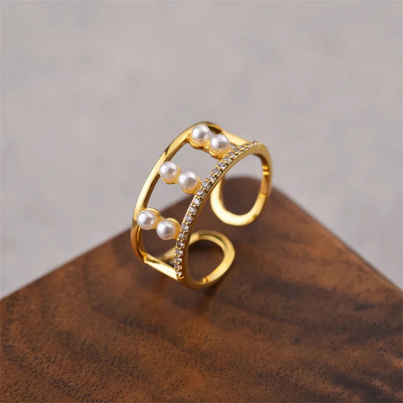 Gold electroplated copper geometric open ring in Korean fashion style, showing adjustable design.