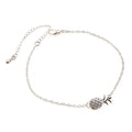 Women's alloy pineapple bracelet on wrist, showing B178 gold or silver finish and fruit-shaped design.