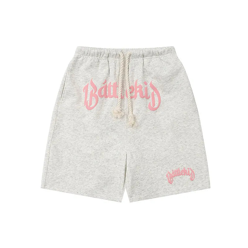 A pair of loose-fit black hip hop shorts made from cotton blend fabric on a mannequin.