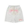 A pair of loose-fit black hip hop shorts made from cotton blend fabric on a mannequin.