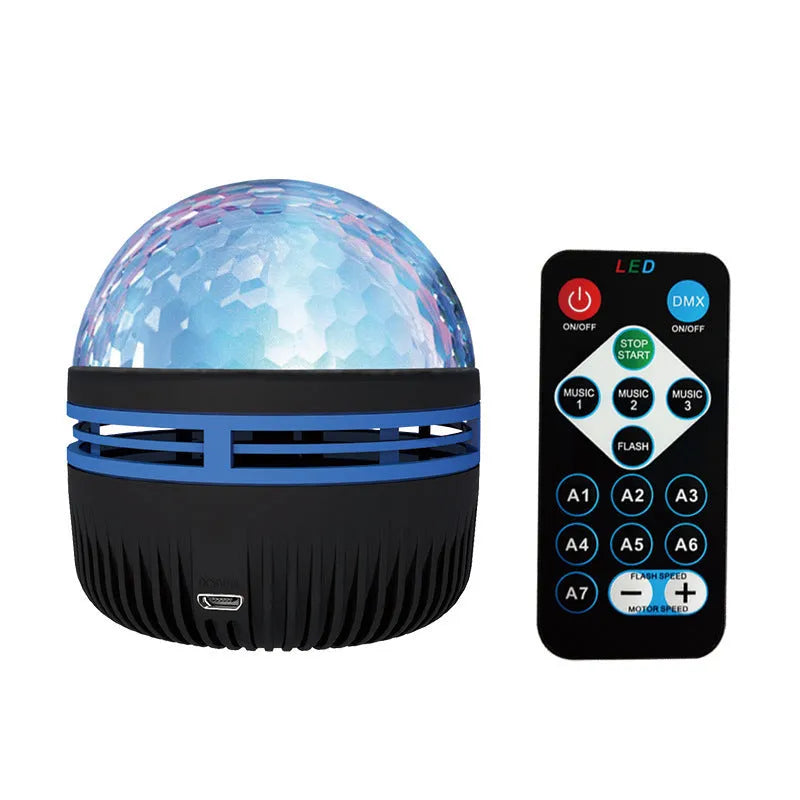 Compact USB-powered LED lamp projecting rotating colourful stars and galaxies onto a dark wall.