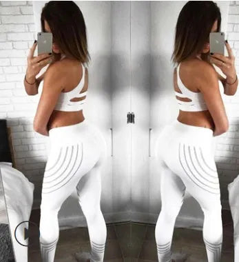 Women's black and white glow-in-the-dark workout leggings with slim-fit design