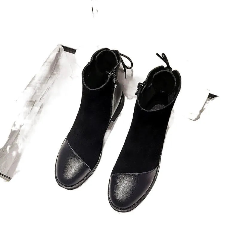 Women's black knee-high Martin boots with side zip, round toe, bow detail, and non-slip rubber sole