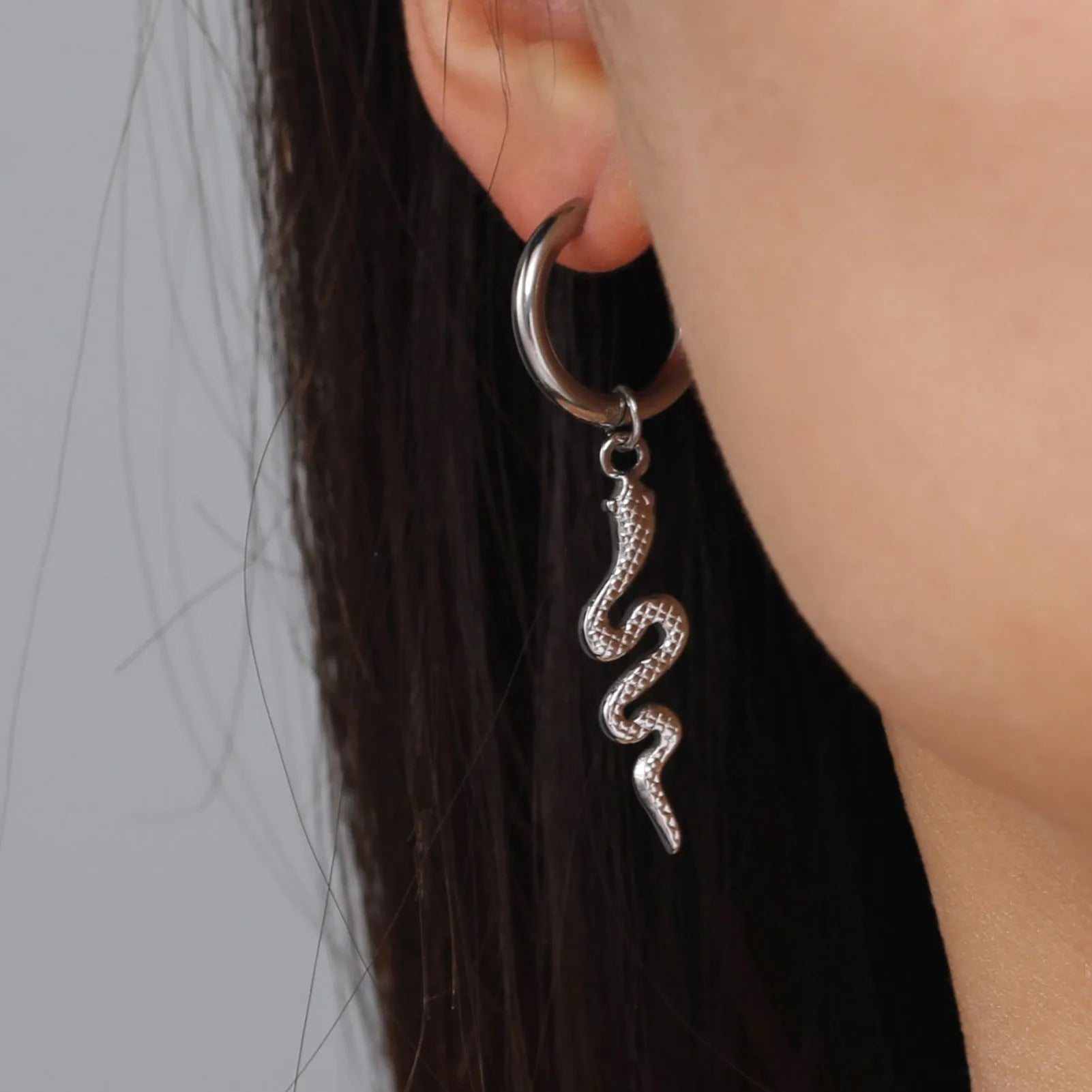 Gold plated stainless steel snake-shaped vintage clip earrings with Zodiac design