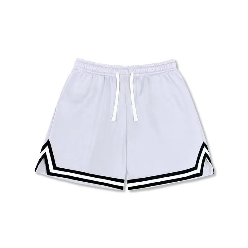 Man wearing loose grey sports shorts made from elastic polyester fabric.