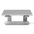 Black aluminium laptop stand on desk supporting silver laptop at improved viewing height