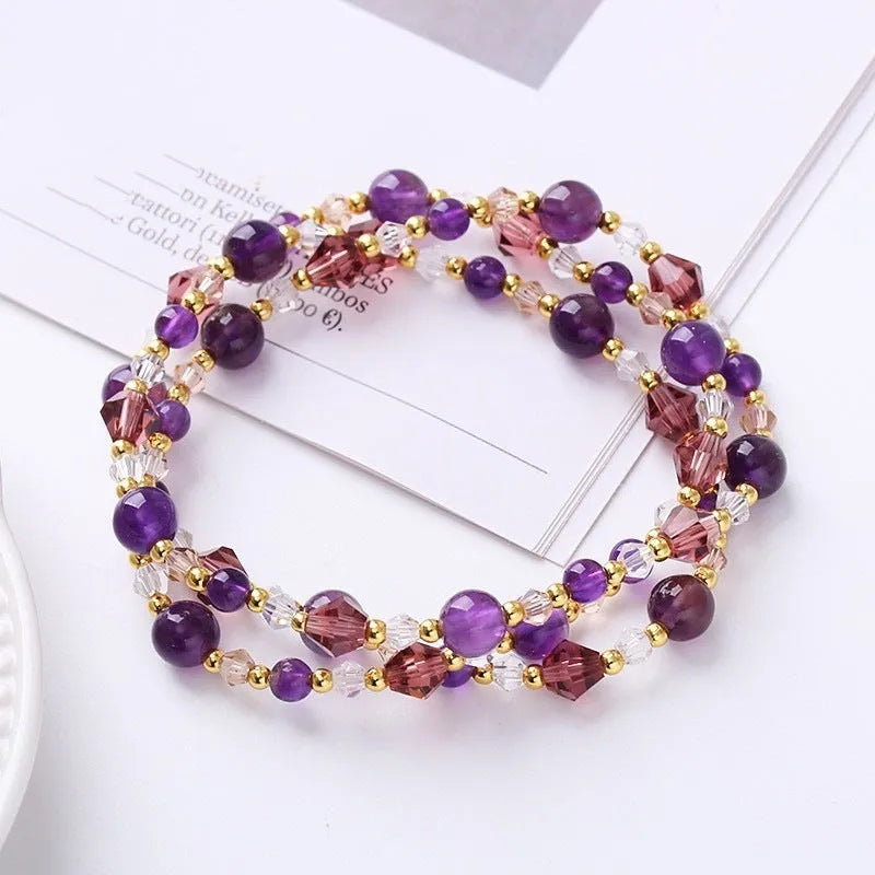 Close-up of a handmade three-stone crystal bracelet with an adjustable cord, shown in a choice of gemstone colours.