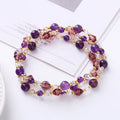 Close-up of a handmade three-stone crystal bracelet with an adjustable cord, shown in a choice of gemstone colours.
