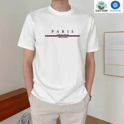 Man wearing a heavy loose-fit pure cotton T-shirt with a letter print on the chest in a casual setting.