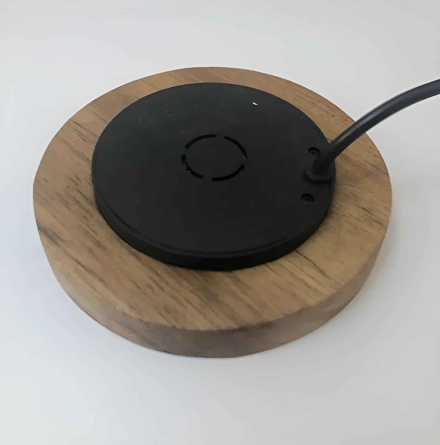 Round black embedded wireless phone charger for desks and tables