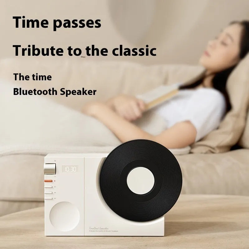 Mini portable Bluetooth speaker in Obsidian Black, Ivory White, Coral Pink, or Plum Green with USB charging port