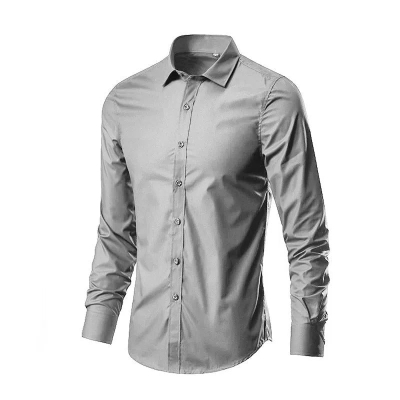Man wearing a loose fit long-sleeve linen shirt in a neutral colour, showcasing the casual silhouette.
