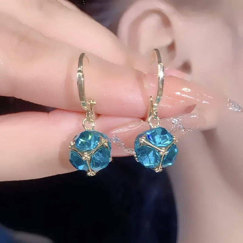 Geometric rose detail zircon earrings for women in copper, available in multiple colours.