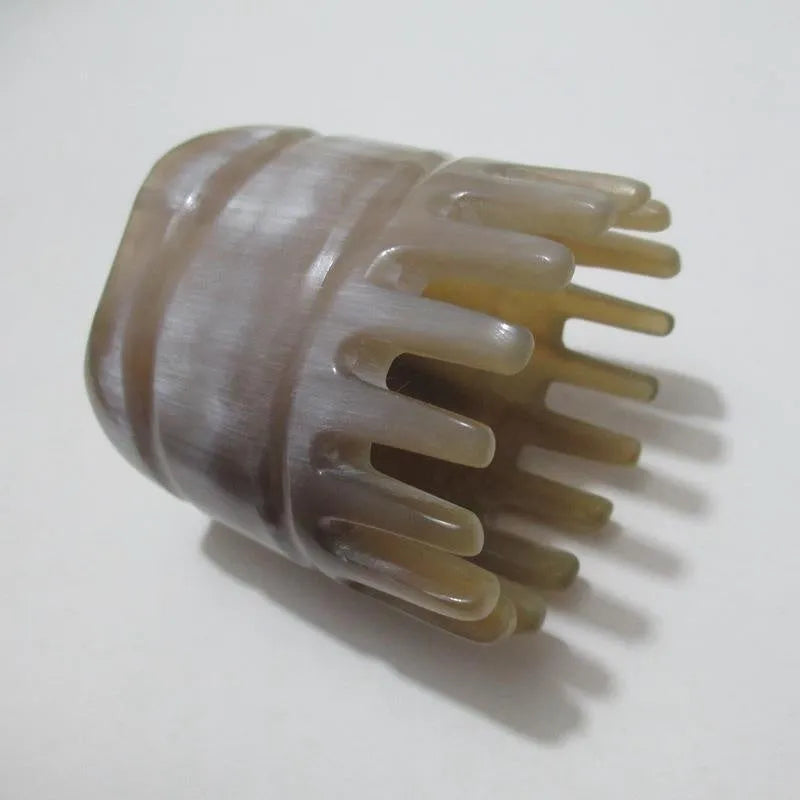 Black buffalo horn comb with wide teeth and fine teeth for head massage.