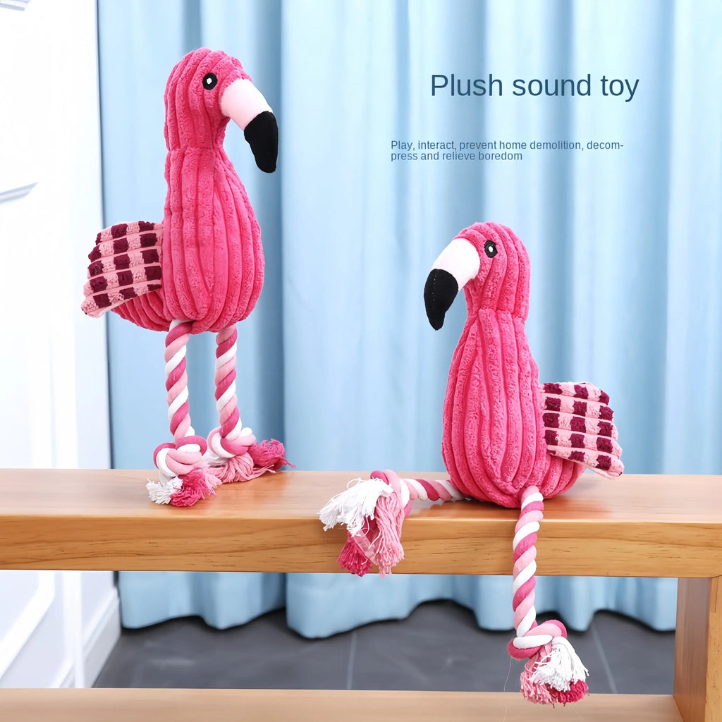 Pink corduroy hippo and parrot squeaky plush dog toys on a white background.