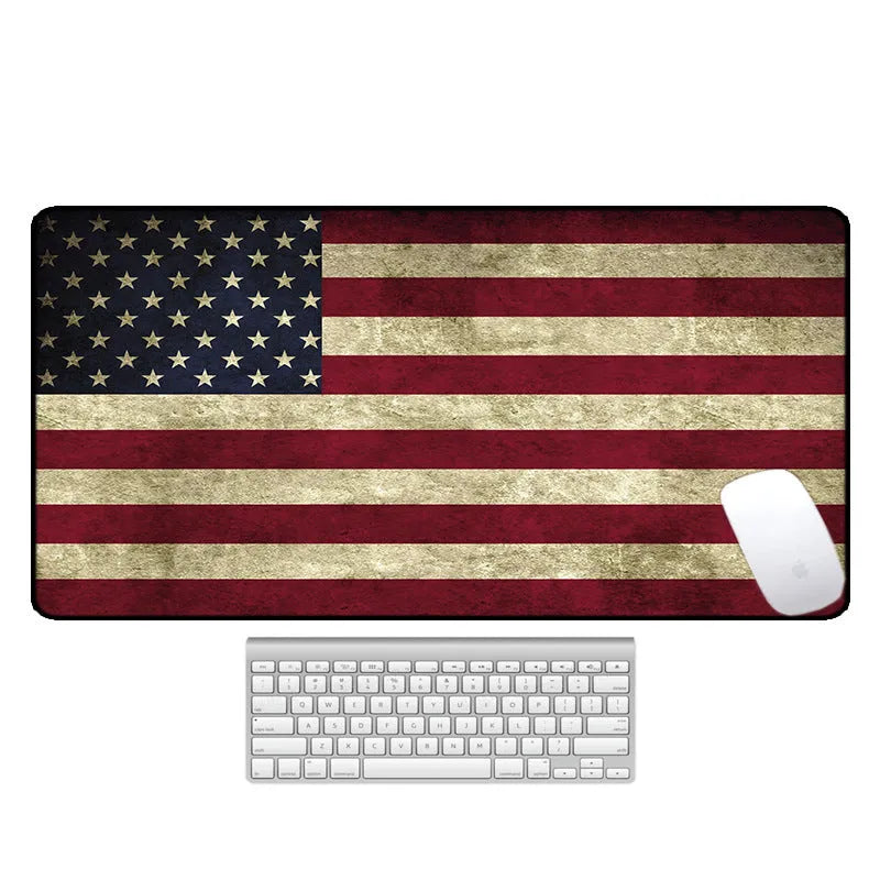 Large natural rubber desk mouse pad with a printed geometric pattern, showing non-slip base.