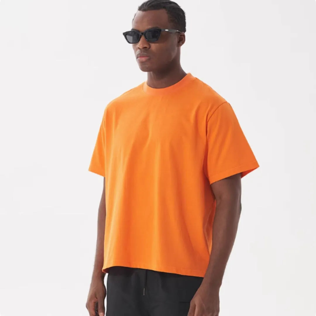 Men's loose fit pure cotton American style T-shirt in apricot colour on a hanger