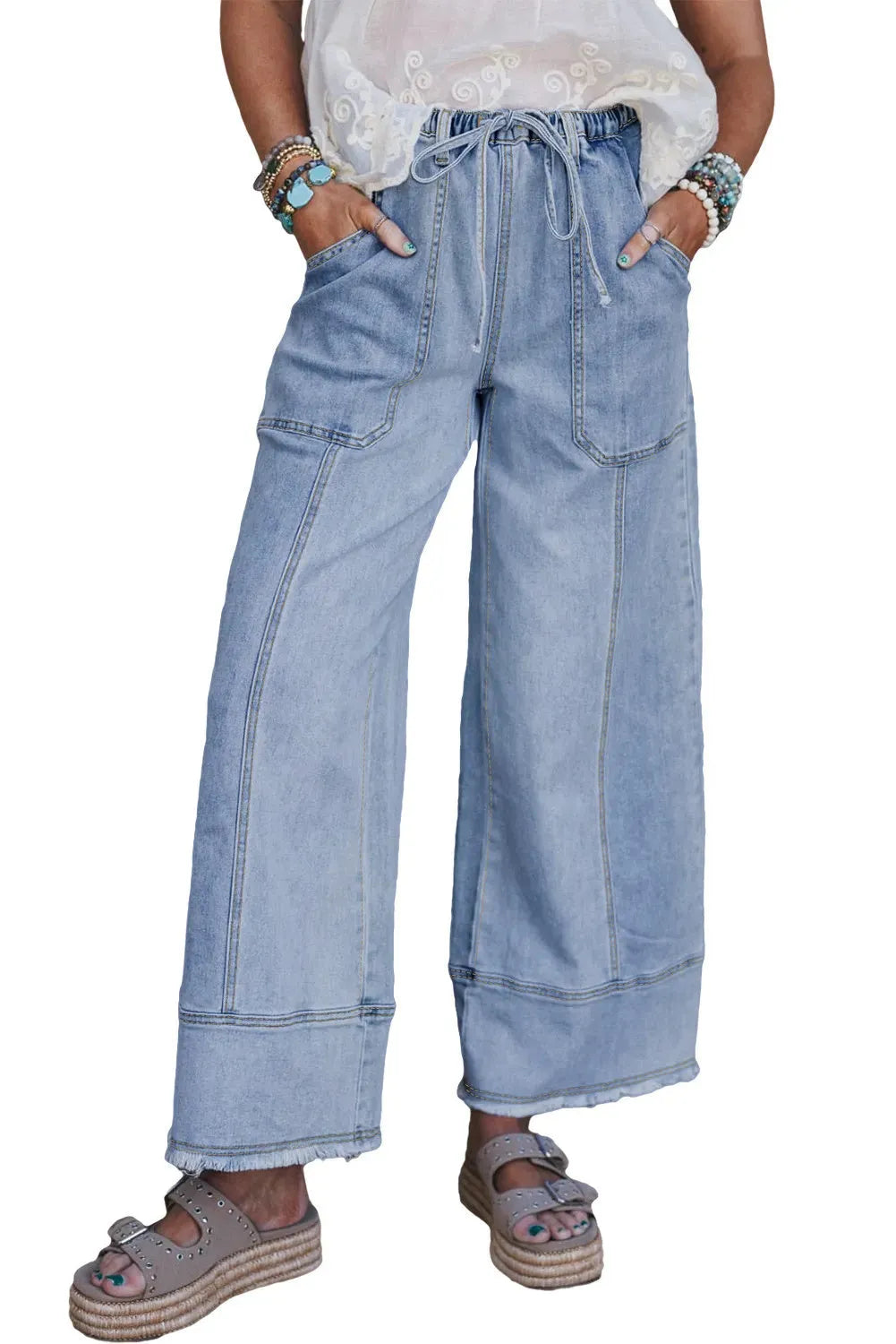 Beau blue wide leg denim trousers with drawstring waist, raw hem finish, and visible seam detailing