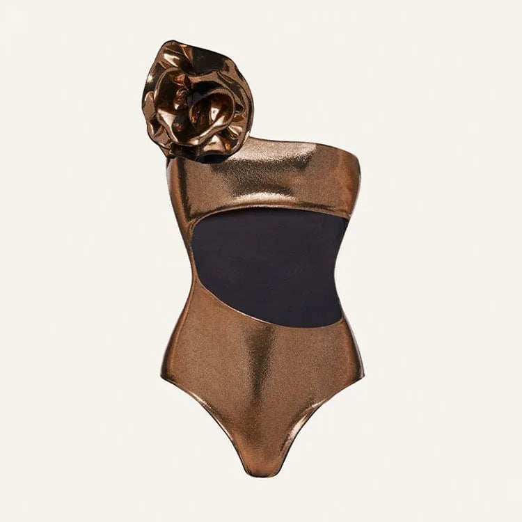 Handmade gold halter neck one-piece swimsuit with hollow out design on a mannequin.
