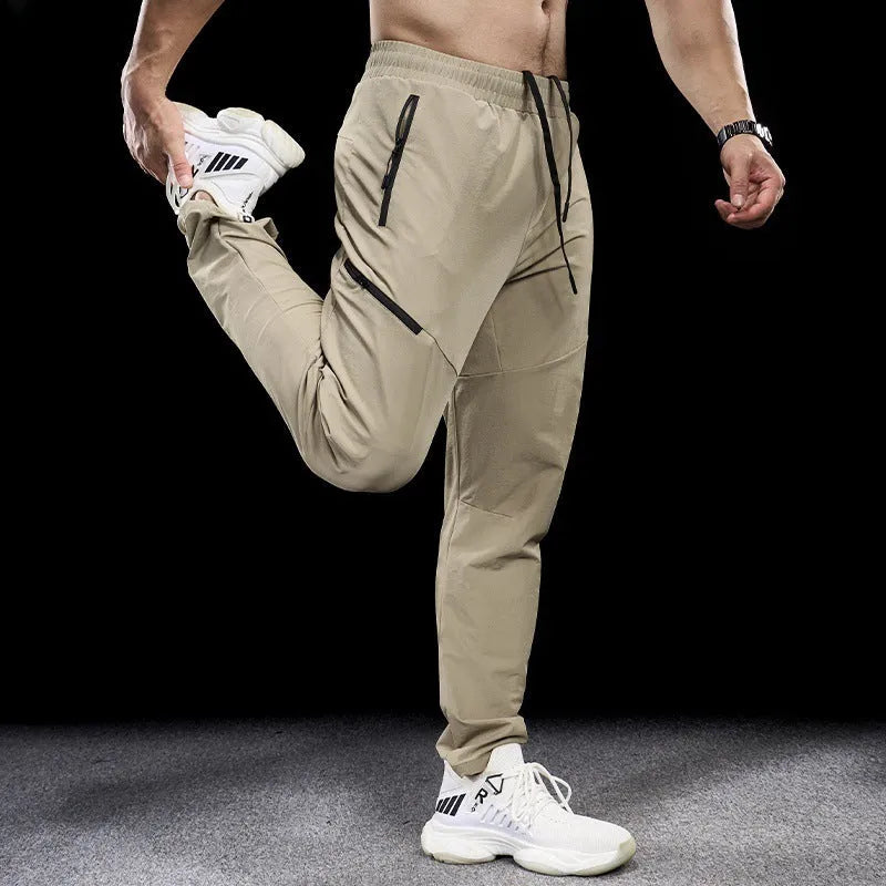 Men's waterproof quick-drying nylon workout trousers in Army Green colour showing mid waist design