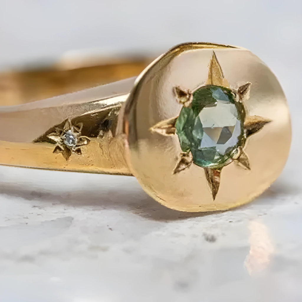 Gold oval ring with asterism detailing and adjustable opening on zinc alloy base