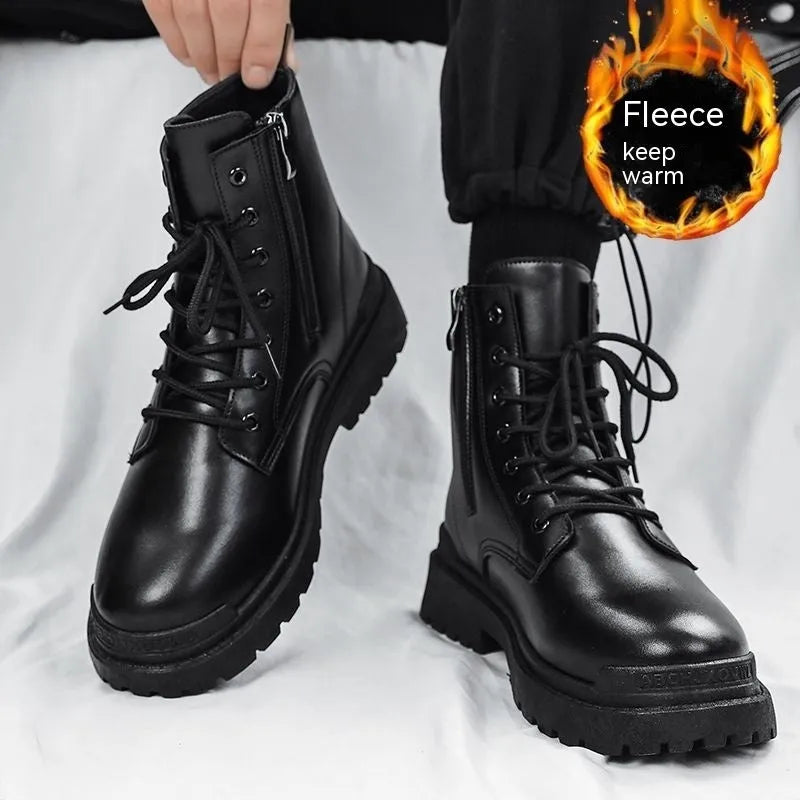 Men's black mid-top British leather boots with flat rubber sole on a neutral background