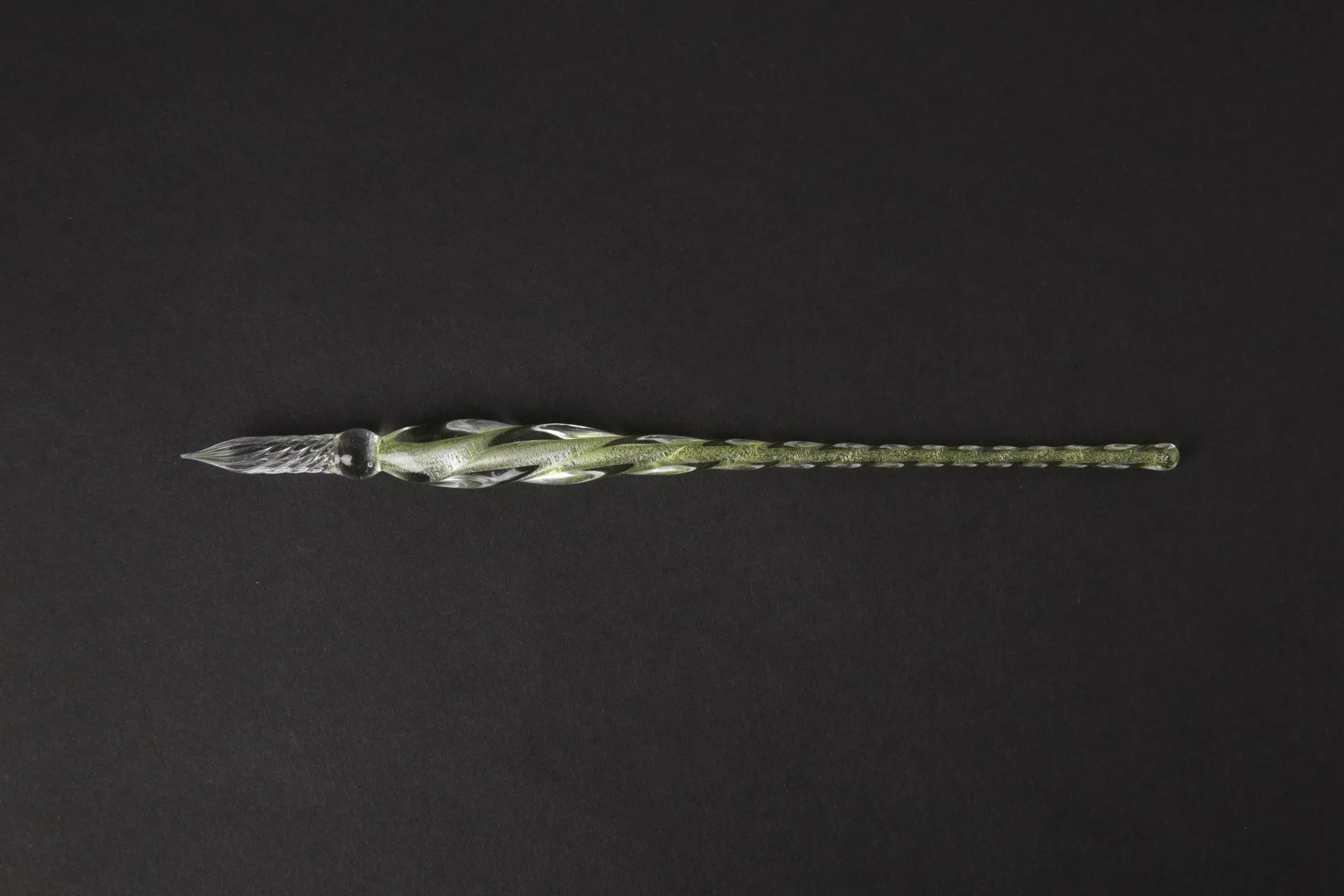 Transparent glass signature pen with coloured ink visible inside, abstract modelling, gift box packaging
