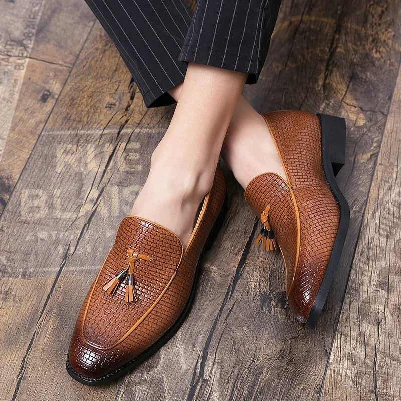 Men's black pointed slip-on business shoes with tassel detail on artificial PU leather upper
