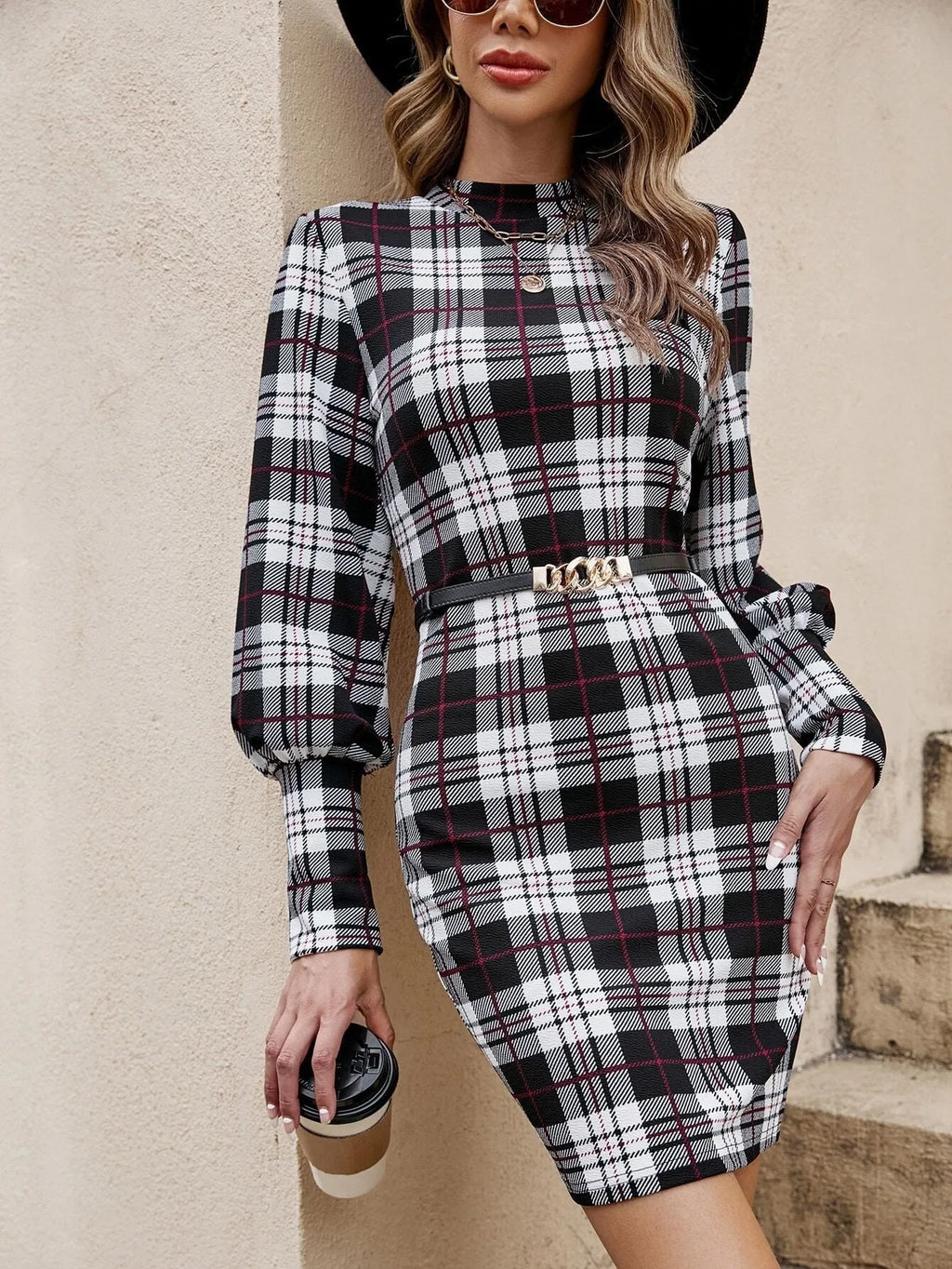 Black tight dress with lantern sleeves and leather stitching detail, modelled in a Japanese Korean casual style.