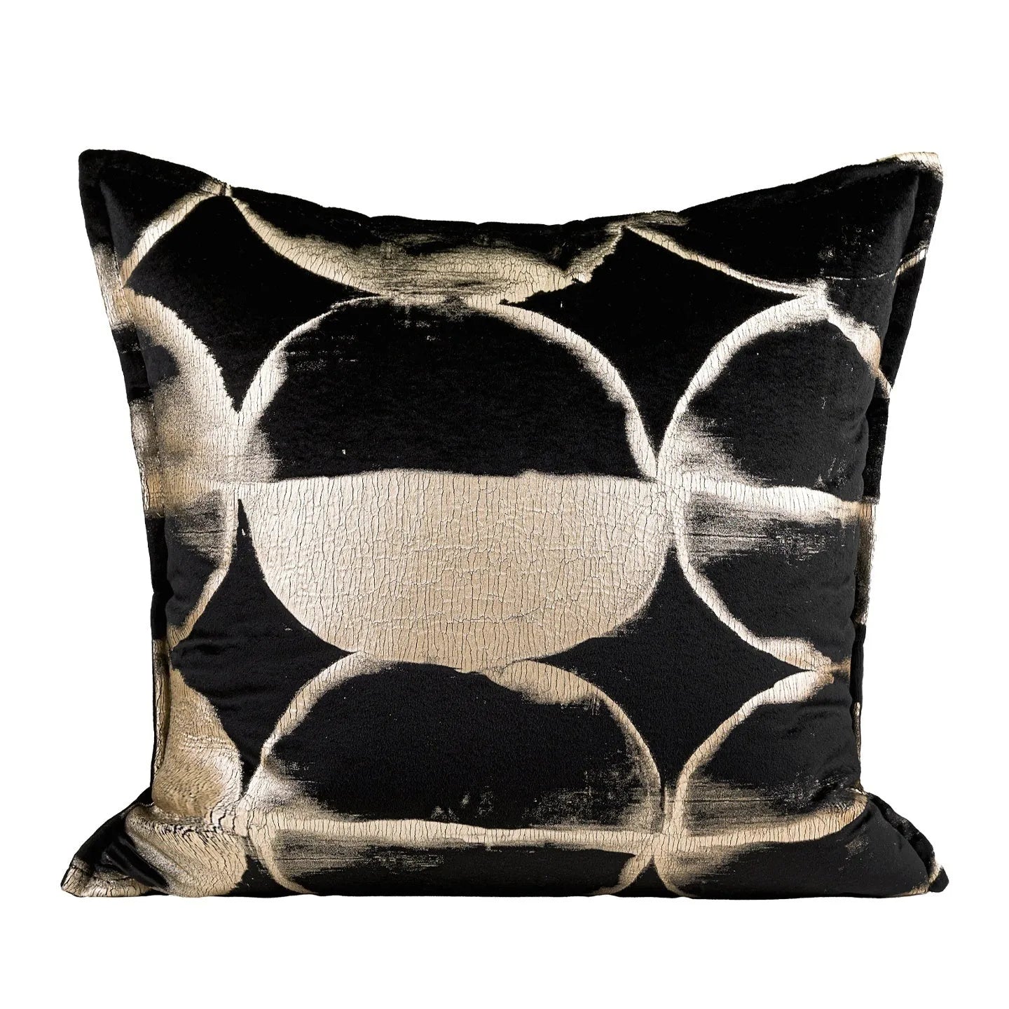 Black and gold abstract patterned flannel cushion in square and bolster sizes on a grey sofa.