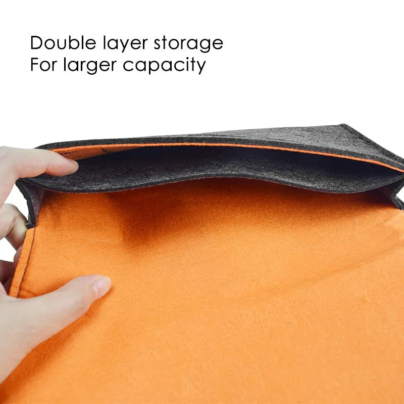 Black felt carrying pouch for Nintendo Switch console with game card slots and storage compartments