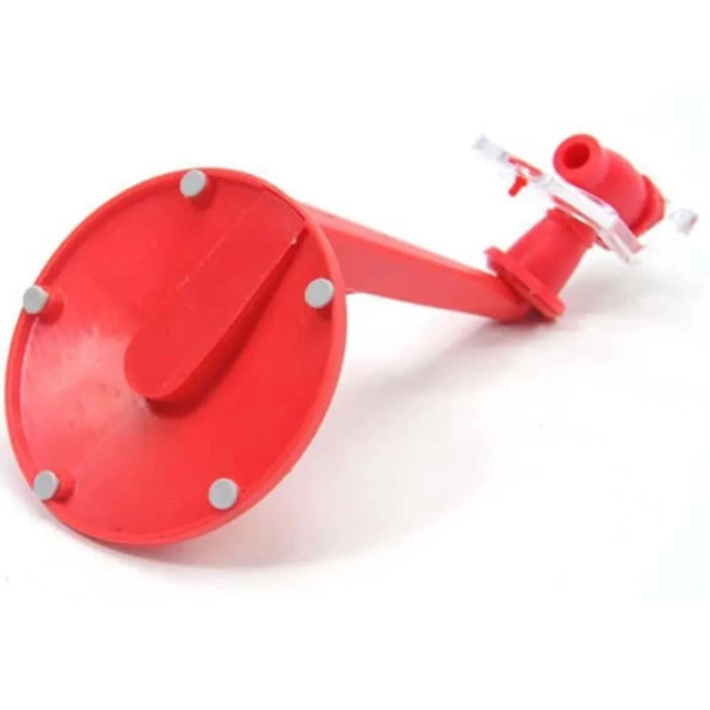 Red plastic Magic Tap soda dispenser attached to an inverted 2-litre bottle for serving fizzy drinks