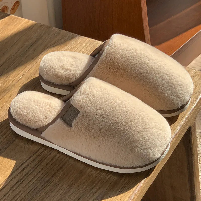 Solid colour PVC winter plush house slippers with car stitching detail on a non-slip sole.