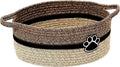Small light beige handwoven cotton rope storage basket with a wooden handle.