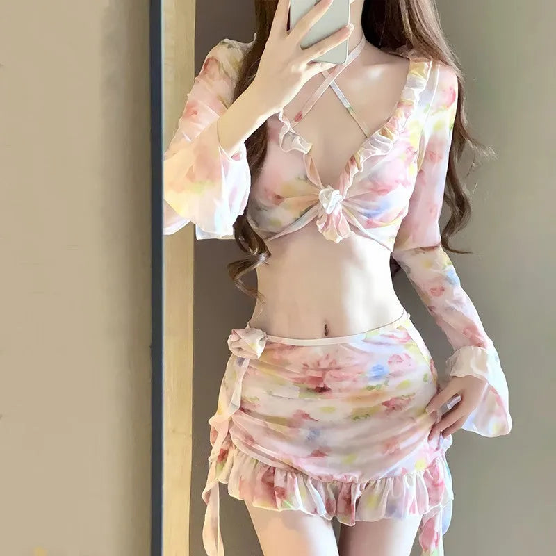 Women's cherry blossom pink floral bikini swimsuit set on a white background.