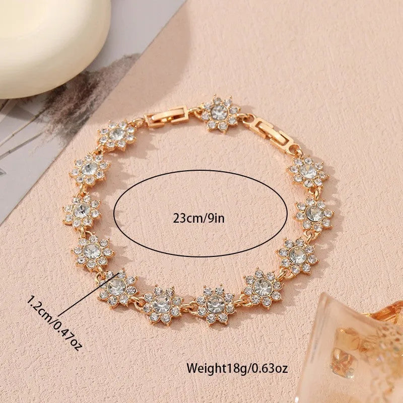 Electroplated zinc alloy bracelet with floral design in gold and silver colour variations
