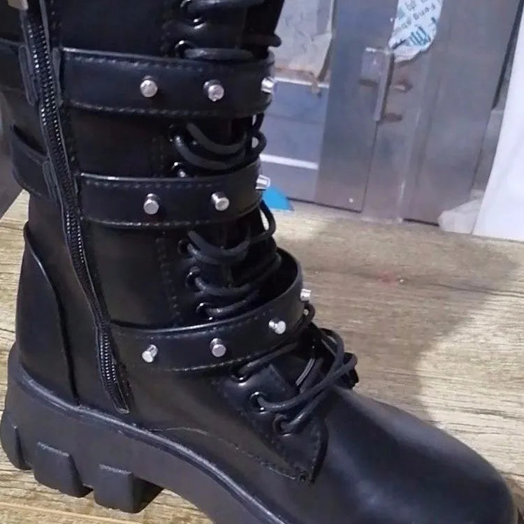 Women's black mid-calf boots with a metal buckle strap and side zipper, made of artificial PU leather.