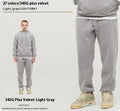 Men's dark brown velvet sweatpants with elastic waistband and banded ankle cuffs on hanger